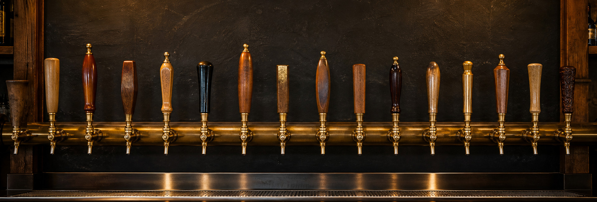 Row of draft beer tap handles behind the bar